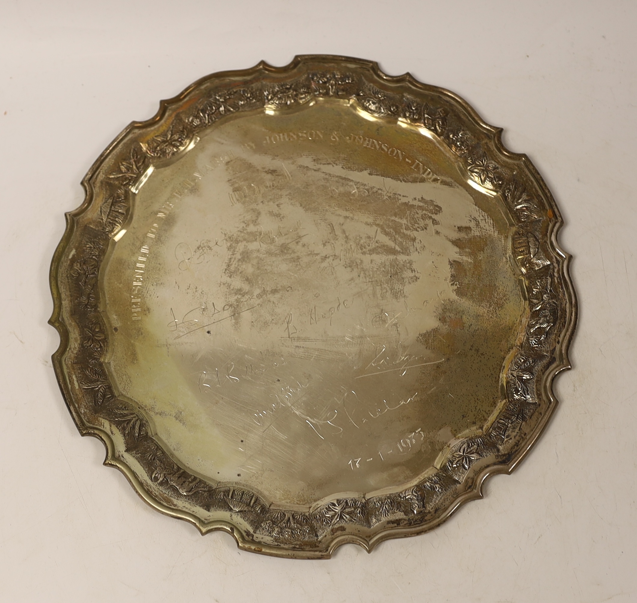 An Indian white metal presentation salver, engraved with signatures, 28.1cm, 19.7oz.